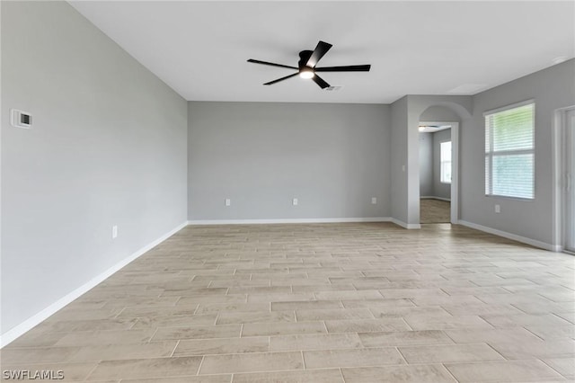 unfurnished room featuring ceiling fan