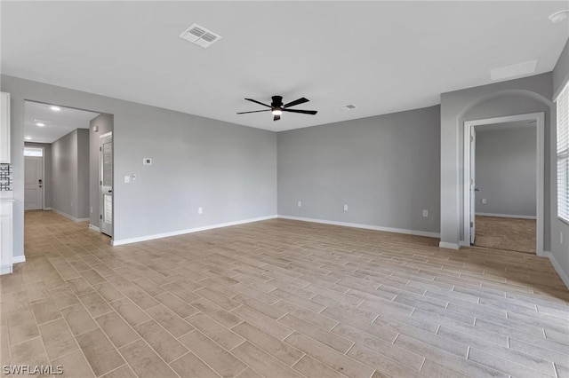 unfurnished room with ceiling fan