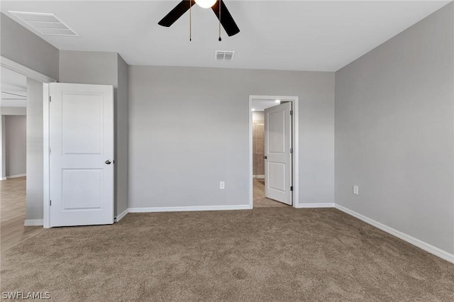 unfurnished bedroom with ceiling fan and light carpet