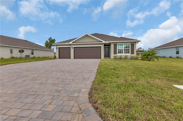 single story home featuring a garage and a front yard