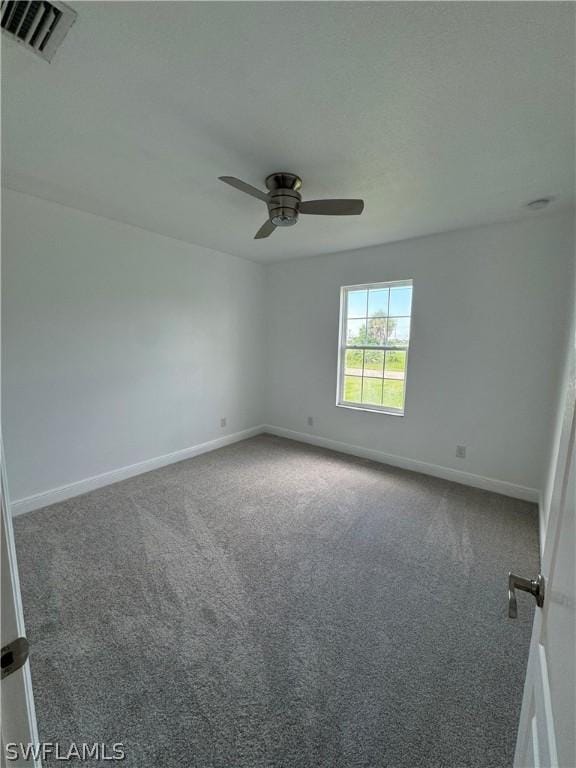 unfurnished room with carpet flooring and ceiling fan