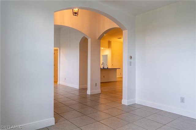 unfurnished room with light tile patterned floors