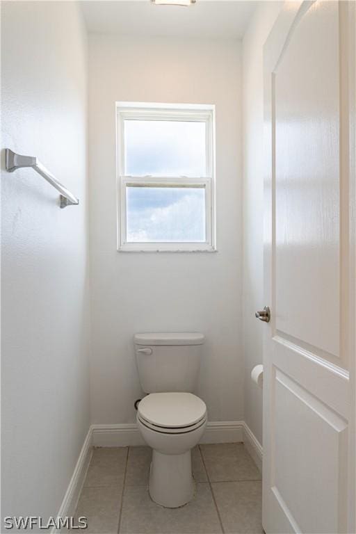 bathroom with tile patterned floors and toilet