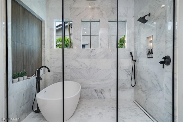 bathroom featuring independent shower and bath and tile walls