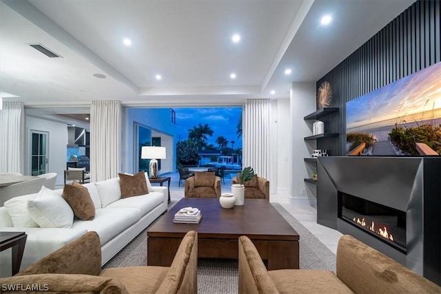 living room with a tray ceiling