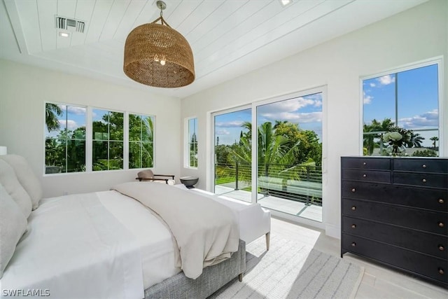 bedroom with access to outside and wood ceiling