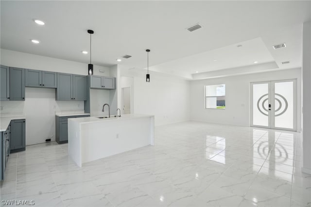 kitchen featuring a center island, pendant lighting, and light tile patterned floors