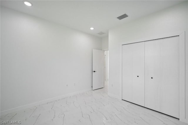 unfurnished bedroom with a closet