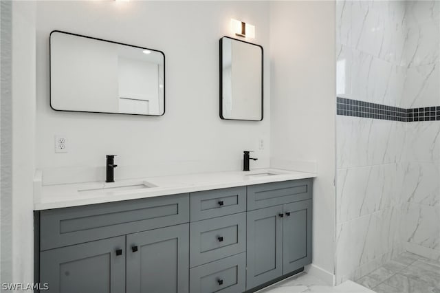 bathroom with tile patterned floors and dual bowl vanity