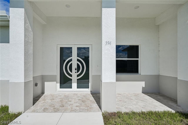 property entrance featuring french doors