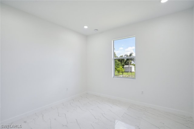 spare room with tile patterned flooring