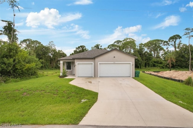 ranch-style home featuring a garage and a front lawn