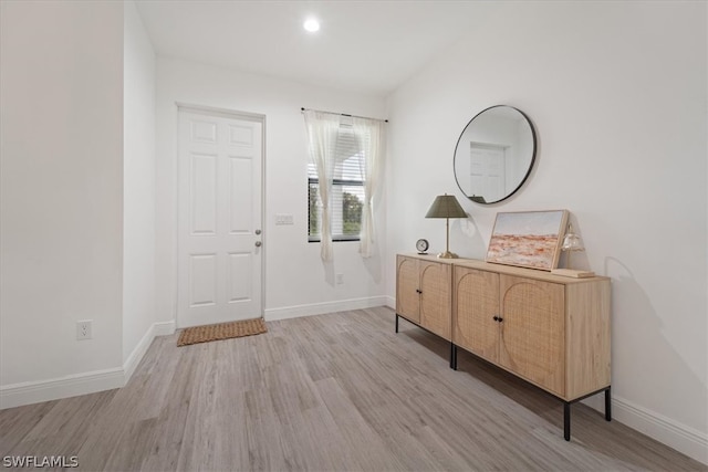 foyer entrance with light hardwood / wood-style flooring