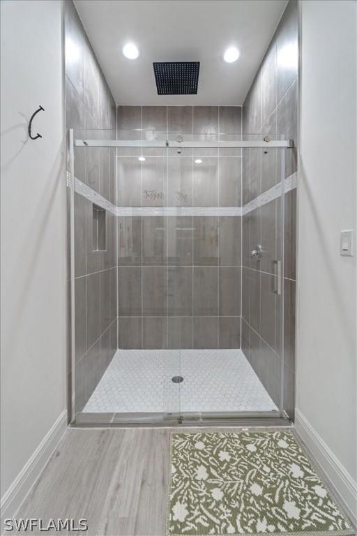 bathroom featuring an enclosed shower