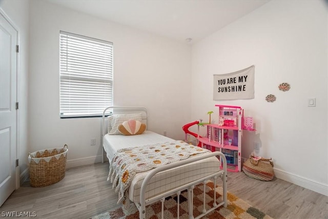 bedroom featuring hardwood / wood-style flooring