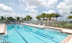 4171 Los Altos Ct, Naples, FL 34109 - community pool featuring fence