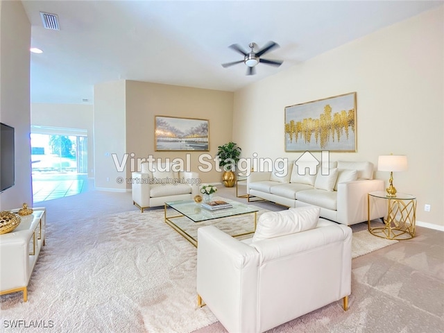 carpeted living area featuring a ceiling fan, visible vents, and baseboards