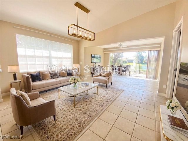 4171 Los Altos Ct, Naples, FL 34109 - living area with baseboards, ceiling fan with notable chandelier, lofted ceiling, and light tile patterned floors