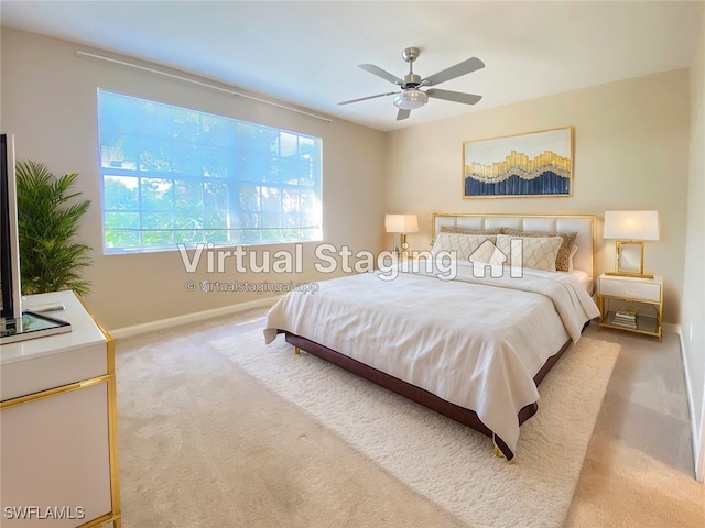 carpeted bedroom with ceiling fan