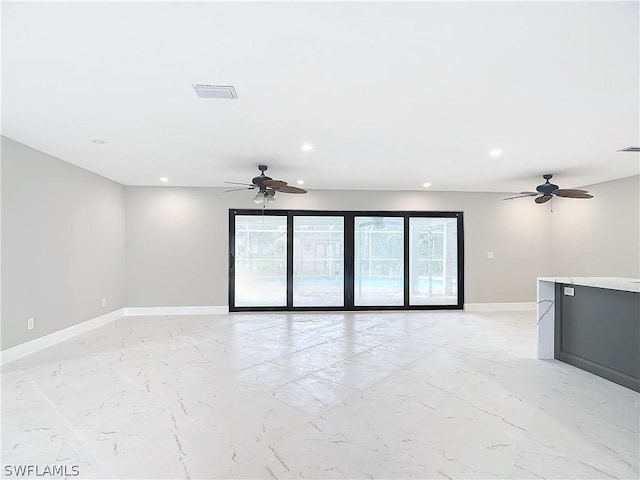 spare room featuring ceiling fan