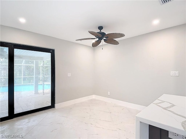 unfurnished room with ceiling fan