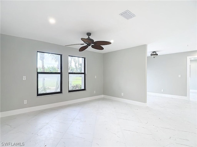 empty room featuring ceiling fan