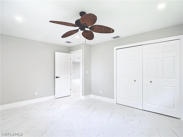 unfurnished bedroom featuring ceiling fan and a closet