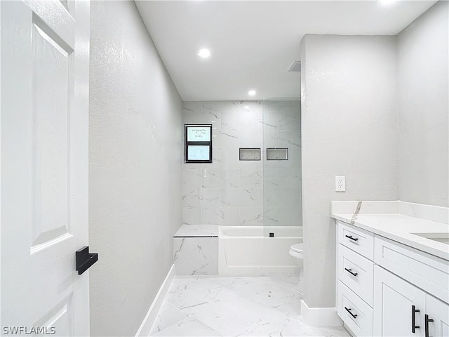 full bathroom featuring vanity, toilet, and tiled shower / bath combo