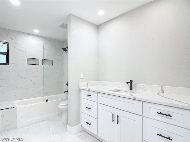 full bathroom with vanity, toilet, and tiled shower / bath combo