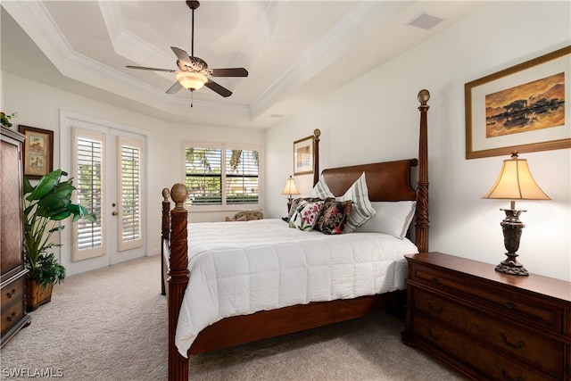 bedroom with light carpet, access to outside, ornamental molding, a raised ceiling, and ceiling fan