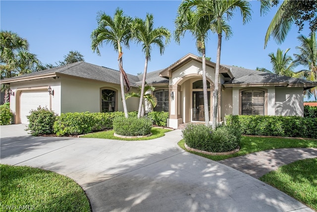 ranch-style home featuring a garage