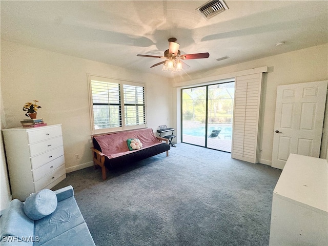 sitting room featuring ceiling fan and carpet flooring