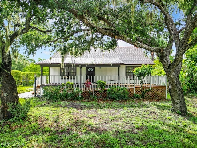 exterior space featuring a yard and a porch