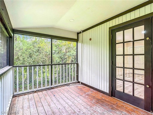 unfurnished sunroom with vaulted ceiling