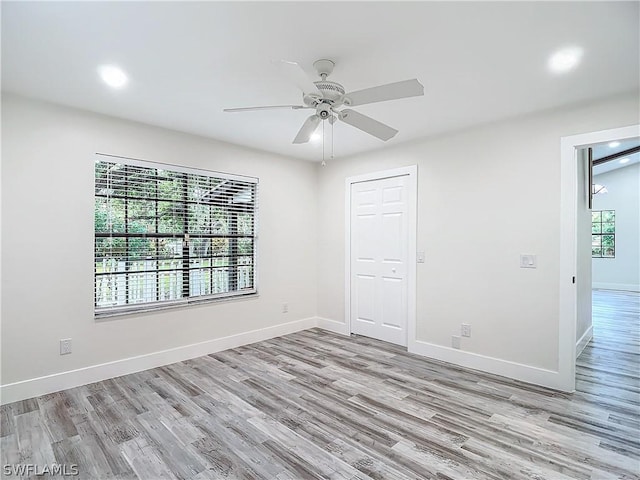 empty room featuring light hardwood / wood-style floors and ceiling fan