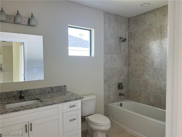 full bathroom featuring tiled shower / bath combo, vanity, tile patterned floors, and toilet