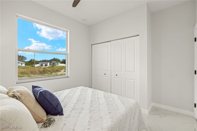 bedroom featuring a closet and ceiling fan