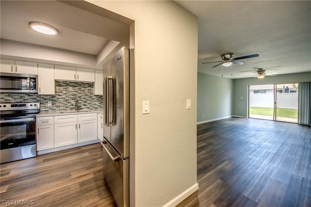 4508 Santa Barbara Blvd Unit 102, Cape Coral, FL 33914 - kitchen featuring appliances with stainless steel finishes, a ceiling fan, white cabinets, decorative backsplash, and a sink