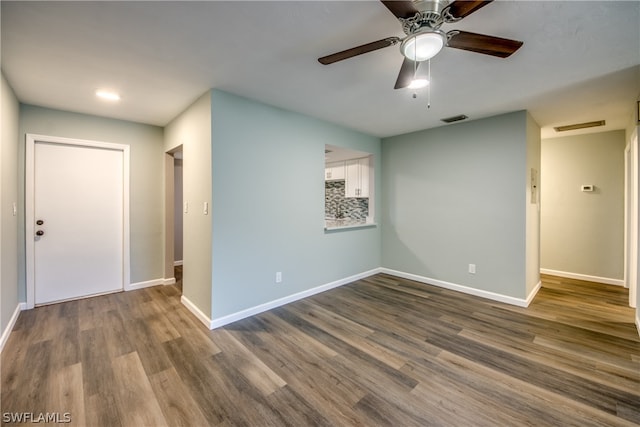 4508 Santa Barbara Blvd Unit 102, Cape Coral, FL 33914 - spare room featuring baseboards, dark wood-style floors, and ceiling fan