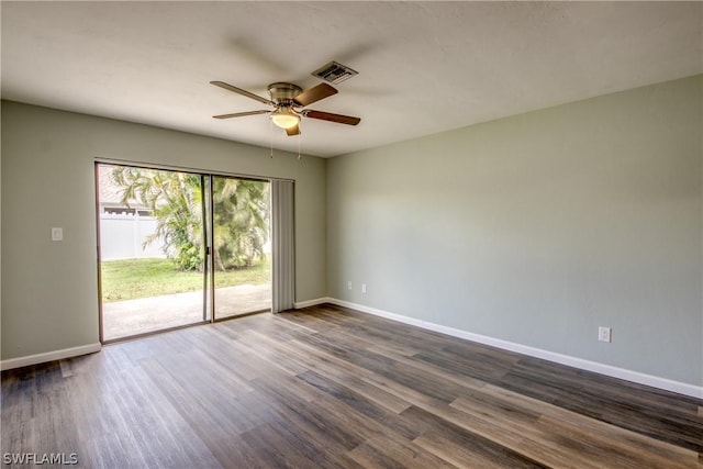 4508 Santa Barbara Blvd Unit 102, Cape Coral, FL 33914 - spare room featuring a ceiling fan, dark wood-style flooring, and baseboards