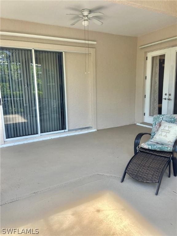 view of patio with a ceiling fan and french doors