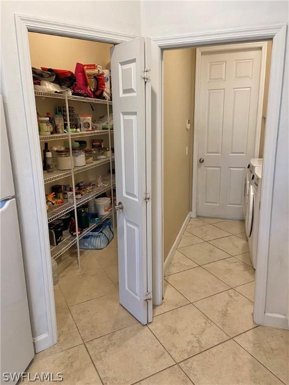 pantry featuring washer and dryer