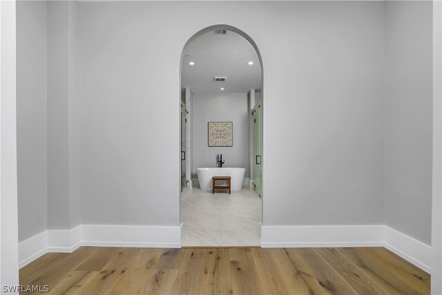 hallway featuring light hardwood / wood-style floors