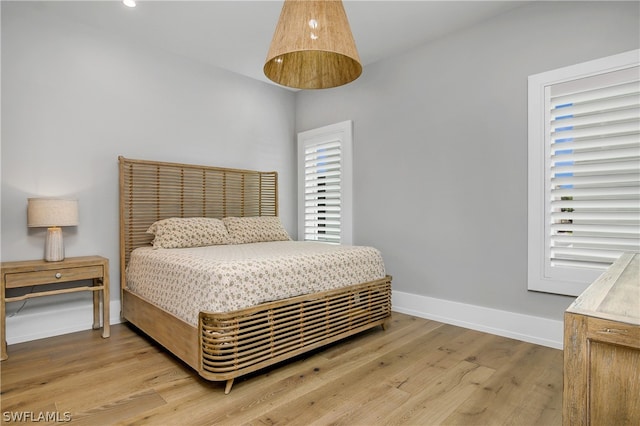 bedroom with light hardwood / wood-style floors