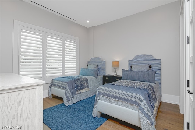 bedroom with wood-type flooring