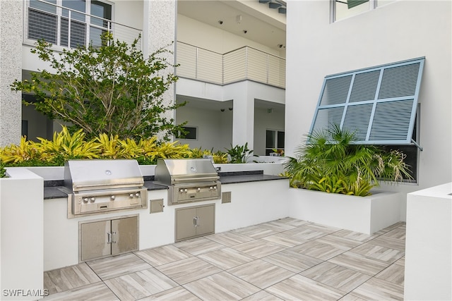 view of patio / terrace with an outdoor kitchen and grilling area