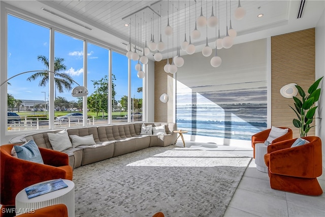 sunroom / solarium featuring a tray ceiling