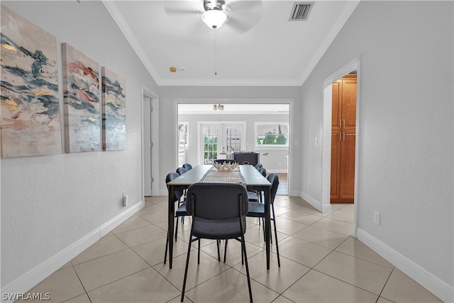 dining space with lofted ceiling, french doors, crown molding, and ceiling fan