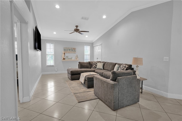 living room featuring ornamental molding, ceiling fan, and vaulted ceiling