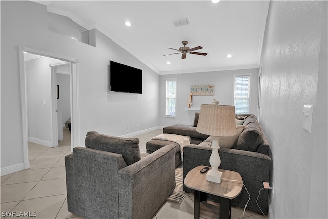 living room with crown molding, ceiling fan, vaulted ceiling, and light tile patterned floors